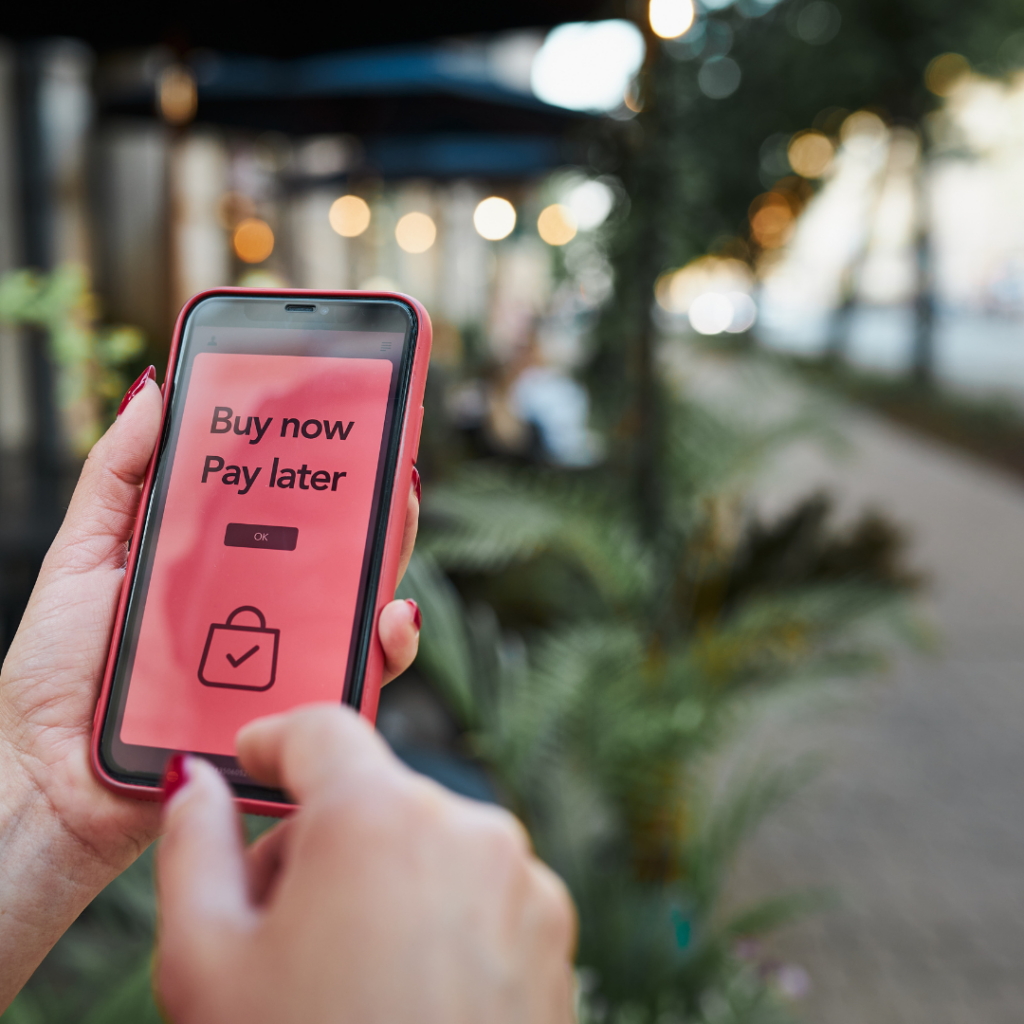 Consumer using a smartphone to select a Buy Now Pay Later option